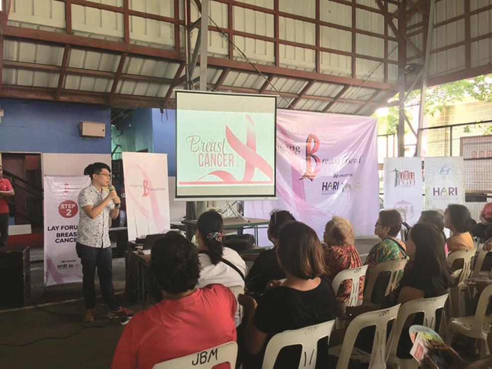 Fig. 2 Dr. Rich King, Chief Fellow of the UP-PGH Division of Medical Oncology (2019), effectively delivers a breast cancer awareness and screening lecture to residents in Ternate, Cavite—most of whom have seen a doctor for the first time.