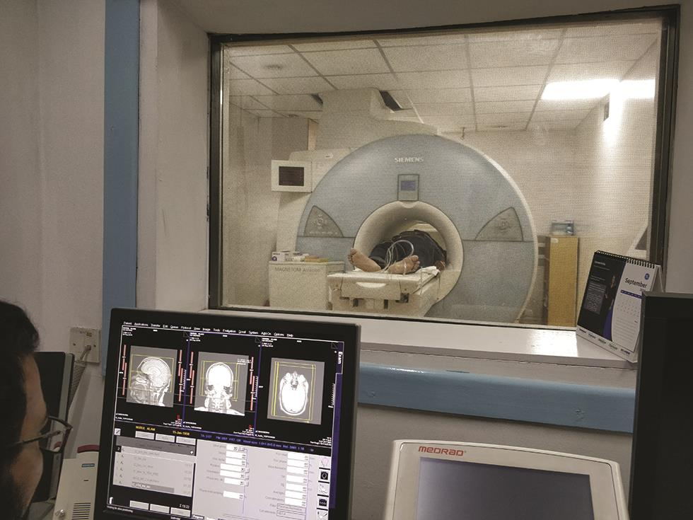 Fig. 3 View from the MRI (magnetic resonance imaging) control console during imaging.